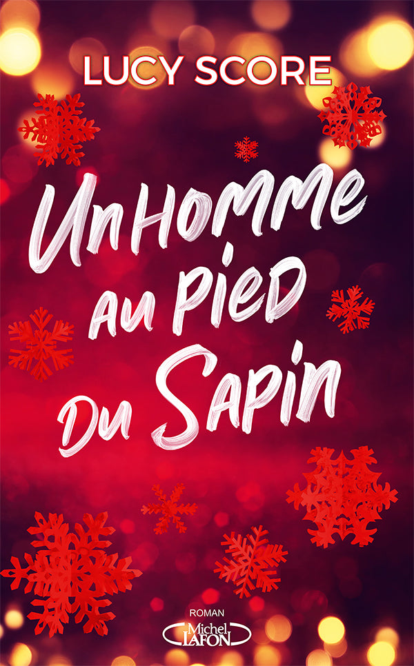 Un homme au pied du sapin
